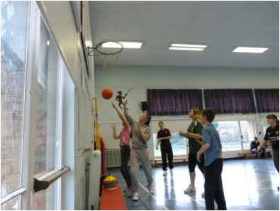 Epping Forest Sportability Club members playing basketball